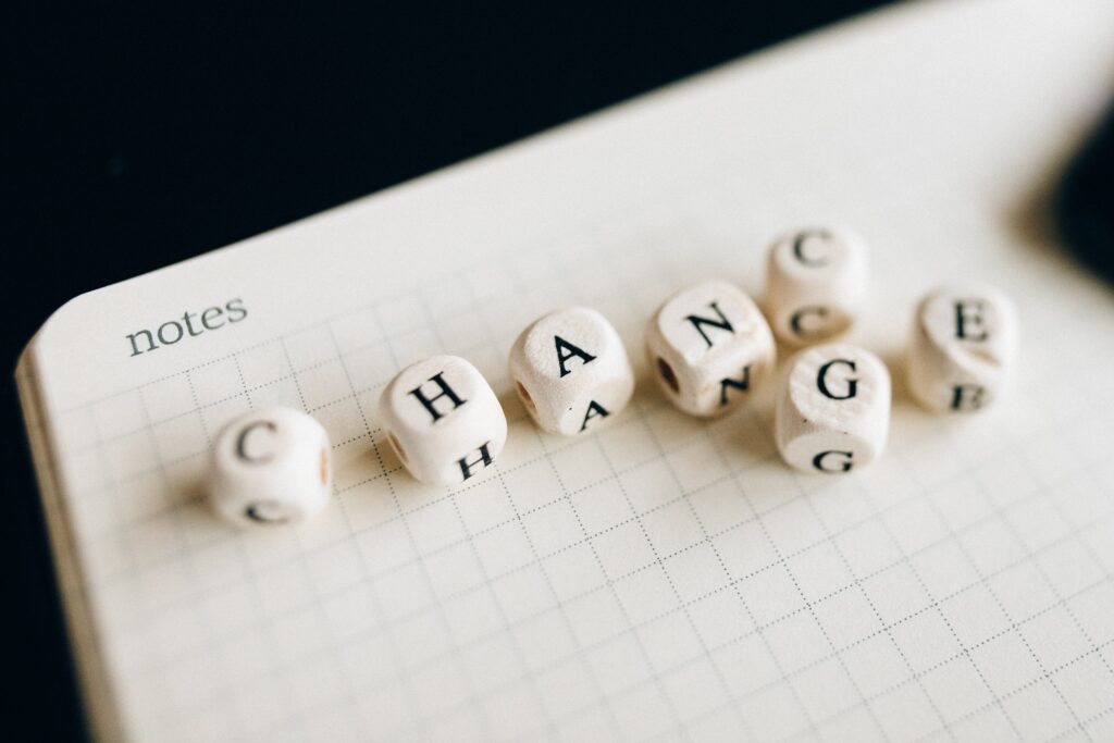 An open notebook with blocks spelling change or chance.