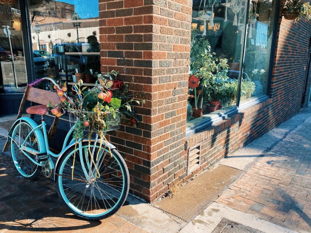Street corner with a blue bike and window displays