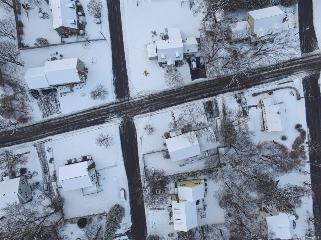 Aerial view of the snow covered neighborhood