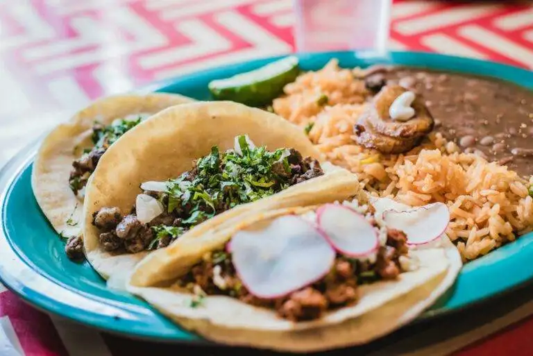 Plate of authentic Mexican tacos, rice, and beans, from new Leesburg restaurants in 2025 by top Realtors Jean Garrell Group