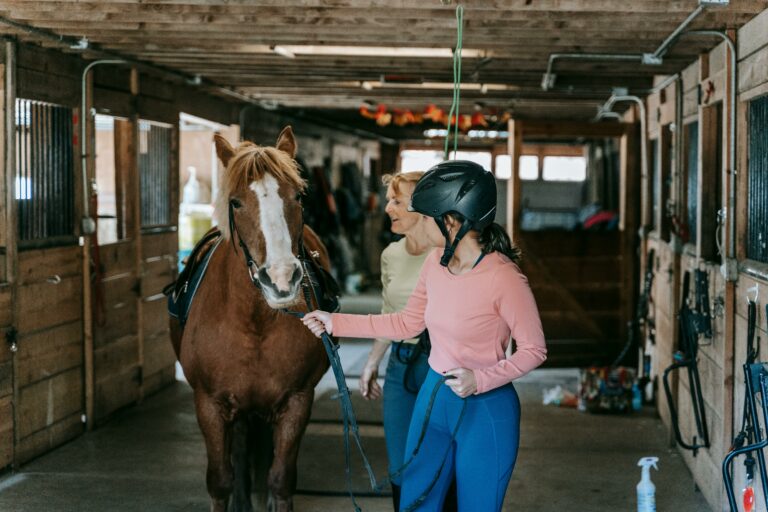 Girl and woman lead a horse to ride in Loudoun County horse country this summer 2025