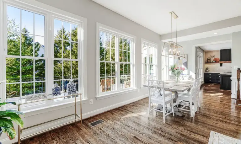 Dining area looking out to trees in Loudoun County sellers home