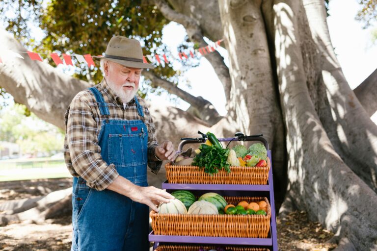 A farmer standing by his produce for sale in local farmers markets in Leesburg Ashburn Sterling VA