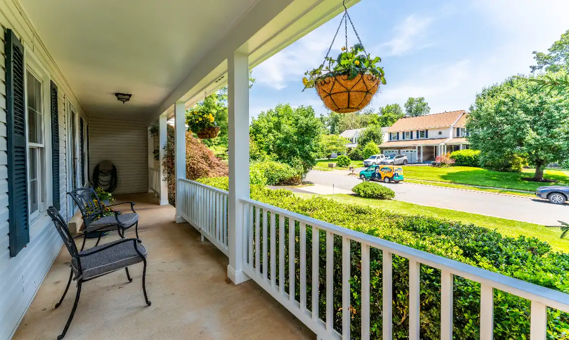 Front porch overlooking a picturesque neighborhood representing things to do in Ashburn by the top local realtor agent team Jean Garrell Group