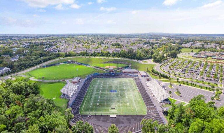 Aerial view of local schools and football fields in the Lansdowne on the Potomac community within Leesburg