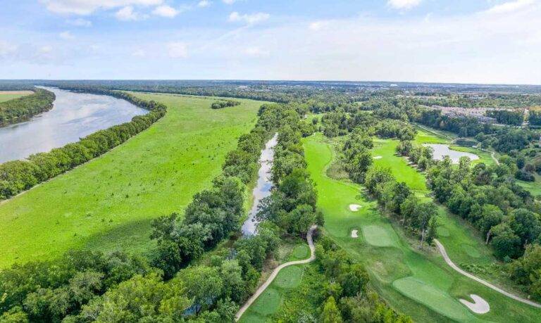 Aerial view of golf course at Lansdowne for selling a house in Leesburg property values