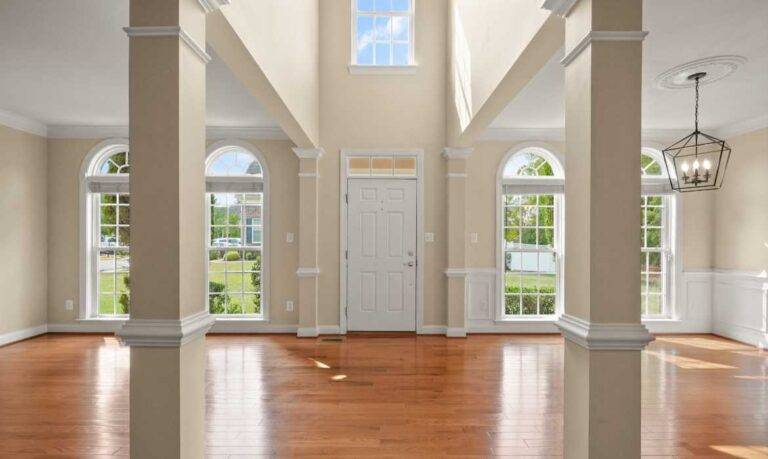 An empty unfurnished foyer and living area of a luxury home in Lansdowne, VA