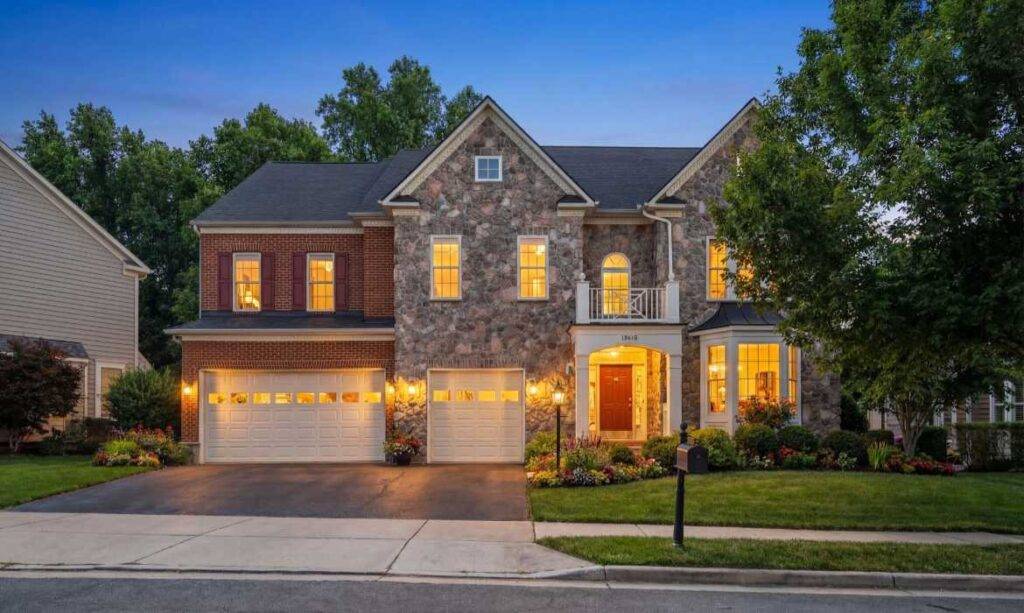 Traditional home with brick and stone siding and two-car garage, sold by top Loudoun County real estate agent team Jean Garrell Group