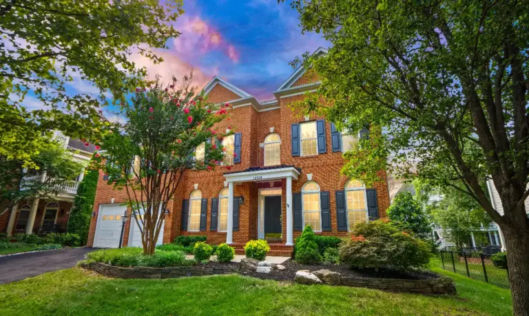 A large brick Colonial home where empty nesters and retirees might choose to downsize to a smaller property using top local buyer and seller agents