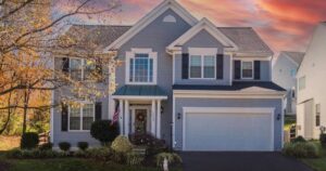 Front exterior of a Sterling real estate listing at dusk, sold by the best realtor agents for buying a home in Loudoun County
