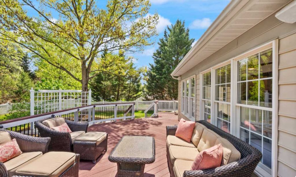 Backyard deck and trees of a luxury home sold by top listing agent Jean Garrell with the Garrell Group, recognized as the best real estate team in Loudoun County for years
