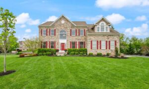 Grand stone brick luxury home in Round Hill, a top relocation destination for professionals moving to Loudoun County, Virginia