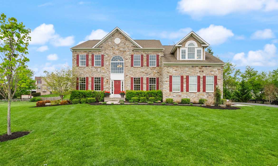 Grand stone brick luxury home in Round Hill, a top relocation destination for professionals moving to Loudoun County, Virginia