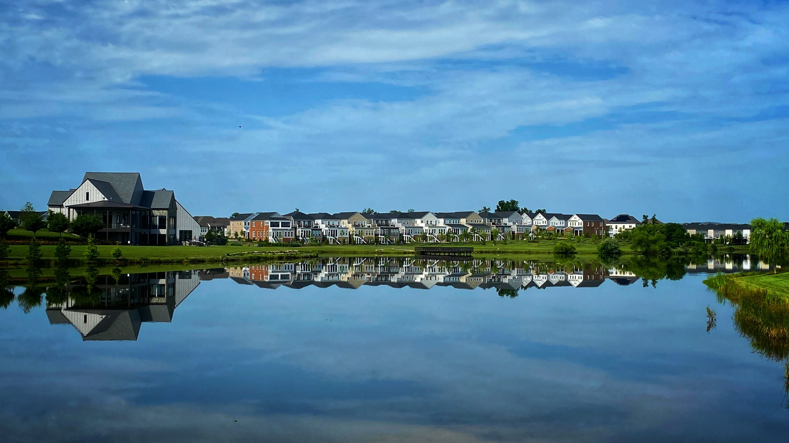 Lake with waterfront homes and walking paths in Brambleton, Virginia